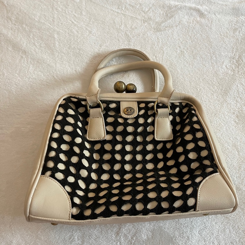 Darling purse w/ retro clips and crochet overlay.